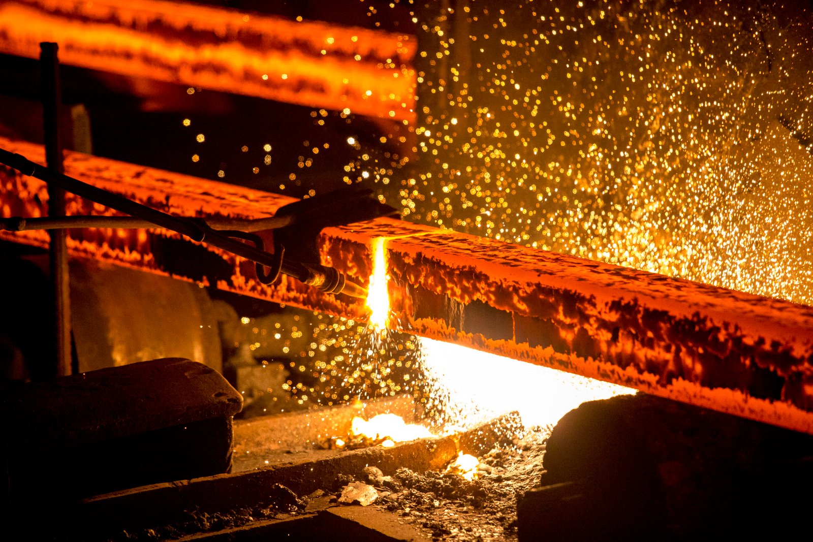 Gas cutting of the hot metal in steel plant at Demra, Dhaka, Bangladesh